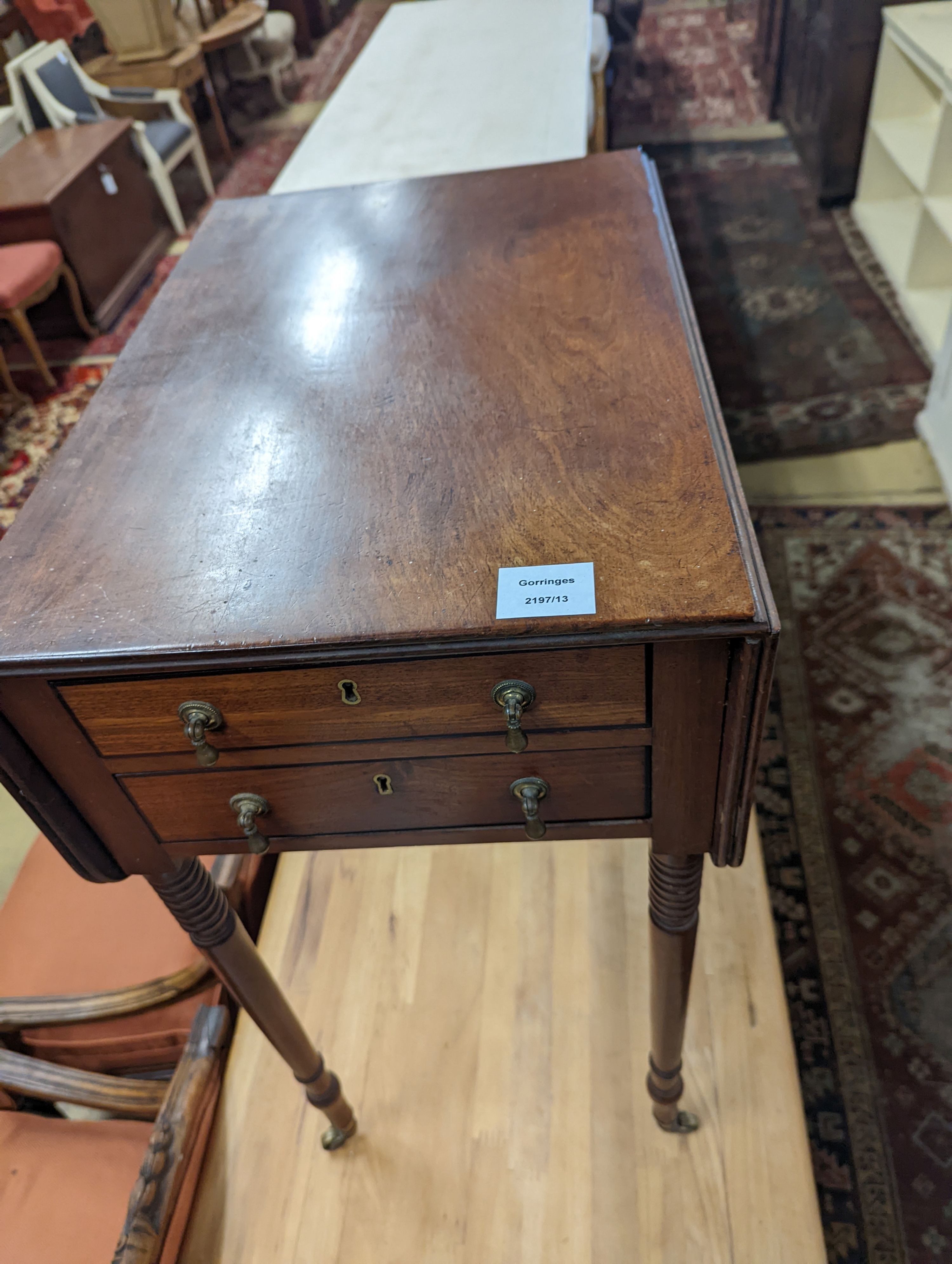 A Regency mahogany drop flap work table, the drawers with brass pear drop handles, width 37cm, depth 53cm, height 73cm